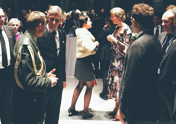 Queen Mathilde's outfit is by Belgian fashion house Natan, and Dries Van Noten Desea Silk Floral printed Dress