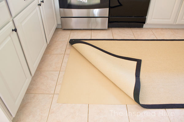 Don't love your tile floors? Sometimes it's not in the budget or the timeline to install all new flooring. Here's how to easily disguise your old floors with something a little prettier!