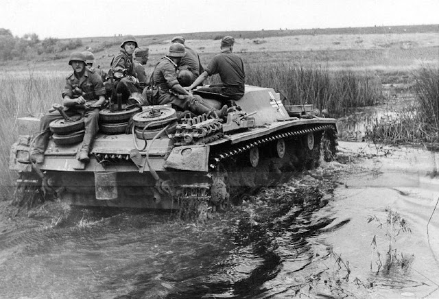 German soldiers on a StuG III near Berezhok in Ukraine, 14 August 1941 worldwartwo.filminspector.com