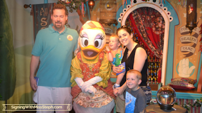 Family standing with circus performer Daisy Duck