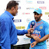 India captain Mahendra Singh Dhoni, right, speaks to Ravi Shastri after the first T20 International