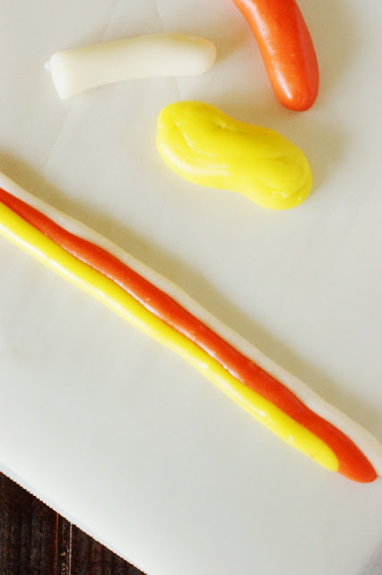 Homemade Candy Corn ~ make your very own version of this iconic Halloween candy!   www.thekitchenismyplayground.com
