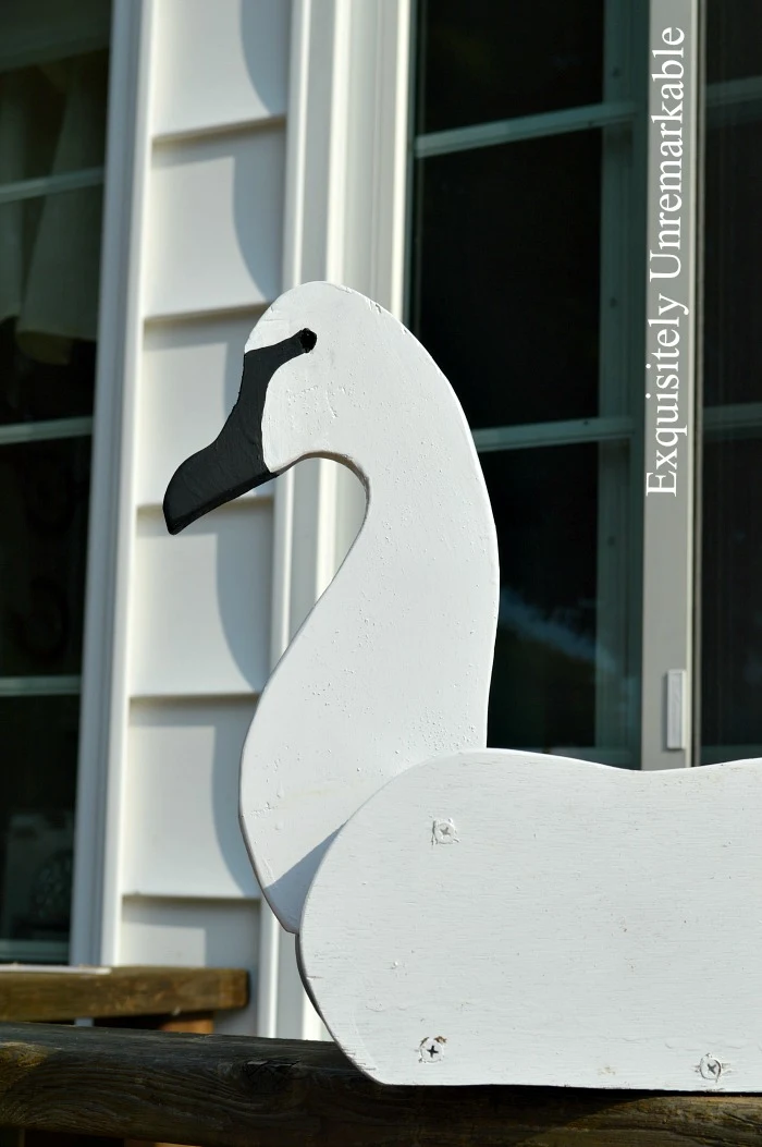 Painted black face and beak on white swan planter