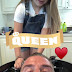 David Beckham gets his hair washed by daughter Harper.