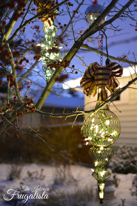Patio lanterns wired with mini lights for the holidays