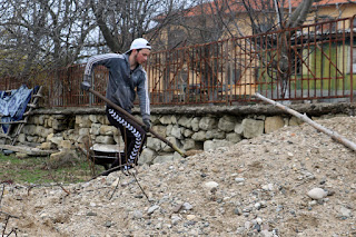 Moving the pile of gravel into the road Moving the pile of gravel into the road