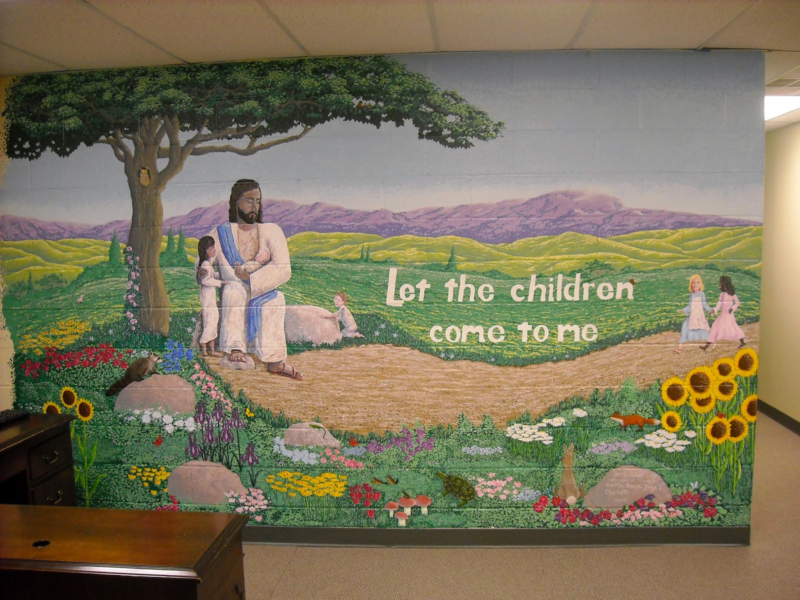 Artist Adron Painting a Mural In Columbia Md. Jesus with the message