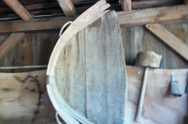 Two handled "shovel" for scooping grain.  A chore for children.