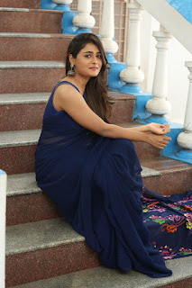 Shalini pandey sitting in steps and giving cute pose