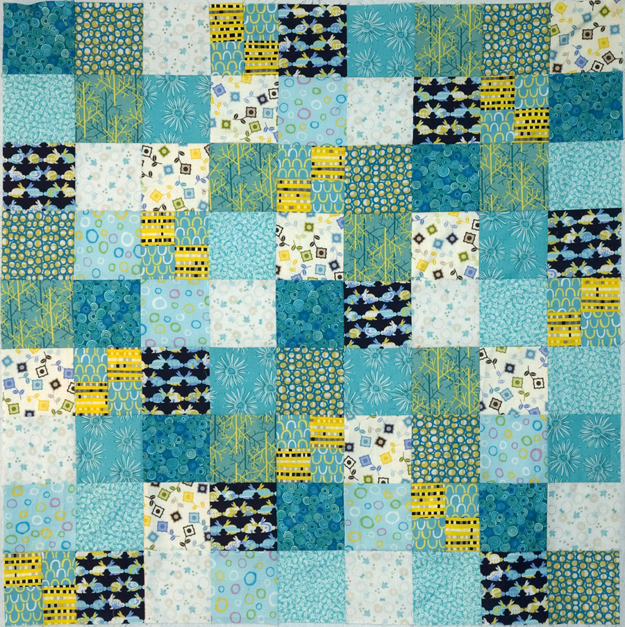 The Objects of Design Turquoise and yellow baby quilt top