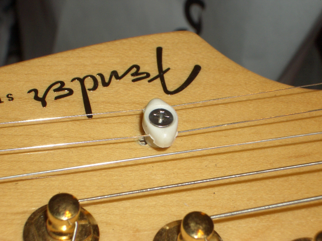 Guitar Snob Graph Tech's Tusq String tree work great!