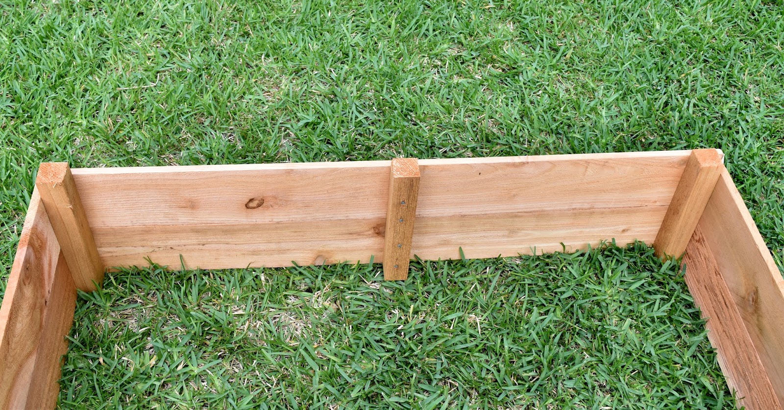 Veena Chimes Raised Beds With Cedar Pickets