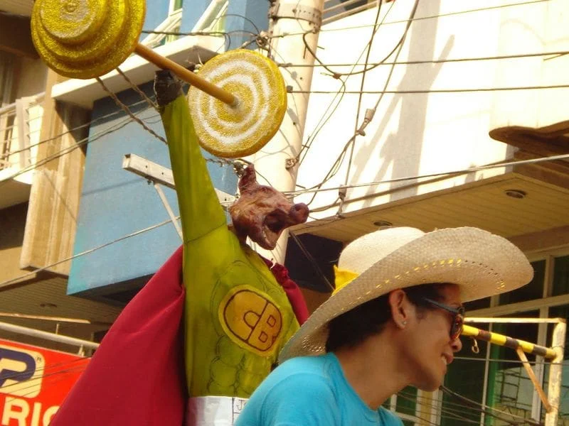 Lechon dressed as Captain Barbell during the La Loma Lechon Festival
