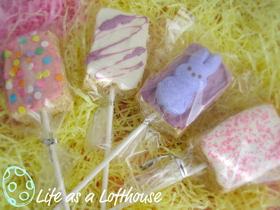 Easter Rice Krispie Pops are rice Krispie treats dipped in candy coating and covered in sprinkles and peeps. Life-in-the-Lofthouse.com