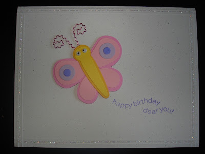 White card with a glittery border and a dimensional butterfly sticker. Sentiment states "happy birthday dear you."
