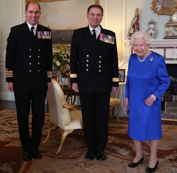 Queen Elizabeth II received the outgoing and incoming Commanding Officers of HMS Queen Elizabeth