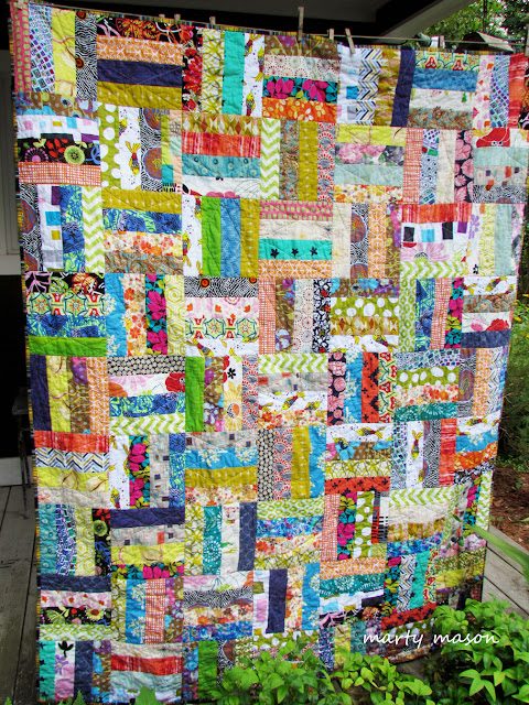 Strips of fabric sewn into a quilt for community service