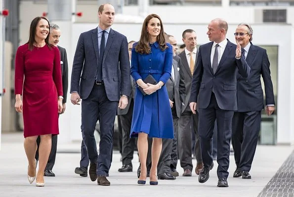 Visit to McLaren, the Duchess wore a blue dress by Eponine, and Rupert Sanderson Malory pumps, a clutch bag by Smythson