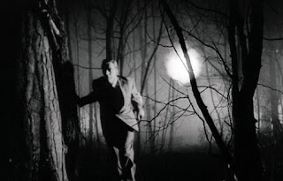 Holden is chased through the woods by an eerie ball of light