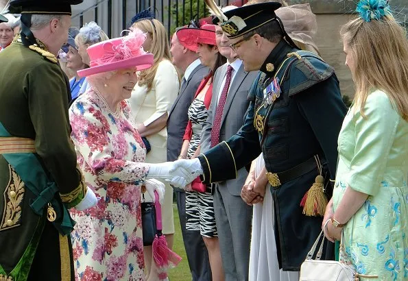 The Queen is hosting a Garden Party in the grounds of the Palace of Holyroodhouse. Scottish rugby player Doddie Weir.