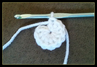 Pictured is the first round of double crochet stitches which form the face of the watch.