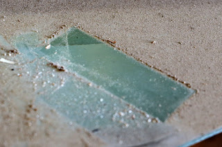 Thick dust on a glass shelf Thick dust on a glass shelf