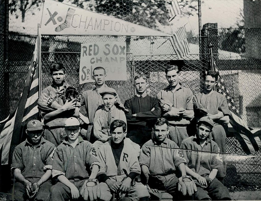Ruth (top row, left, holding a catcher's mitt and mask) at St. Mary's, 1912