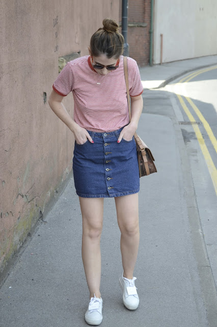 Women's fashion blogger, Denim button down skirt with Red and white striped cotton t-shirt from Urban Outfitters, White sneakers from Acne Studio and Nude bag from Zara