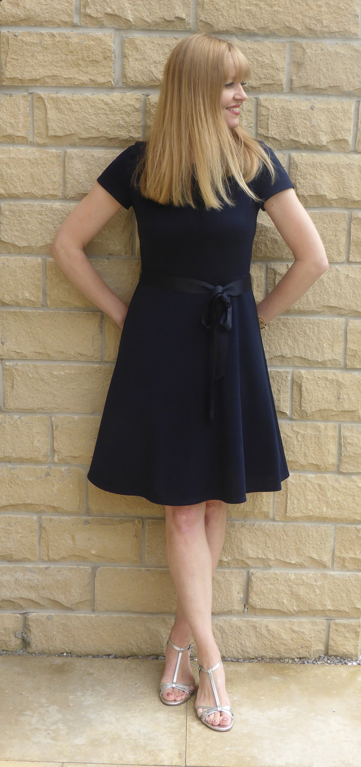 cobalt blue dress and silver shoes These 12 Shoe Colors Always Make Navy Blue Dresses Look So Chic
