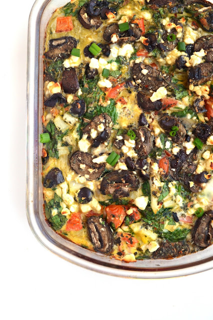 This Greek Egg Casserole combines all your favorite Greek flavors including feta cheese, kalamata olives, tomatoes, onions, peppers and more! www.nutritionistreviews.com