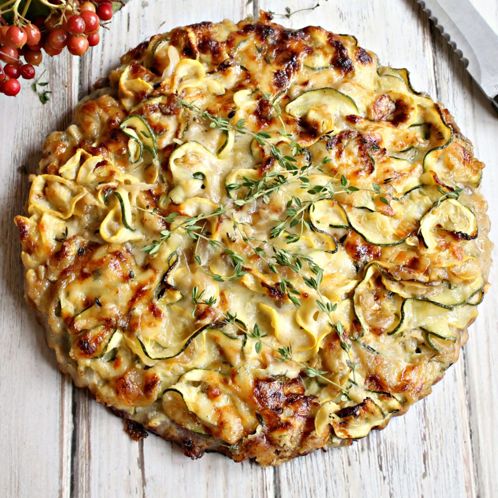 Savory zucchini tart with fontina cheese in a buttery walnut crust.