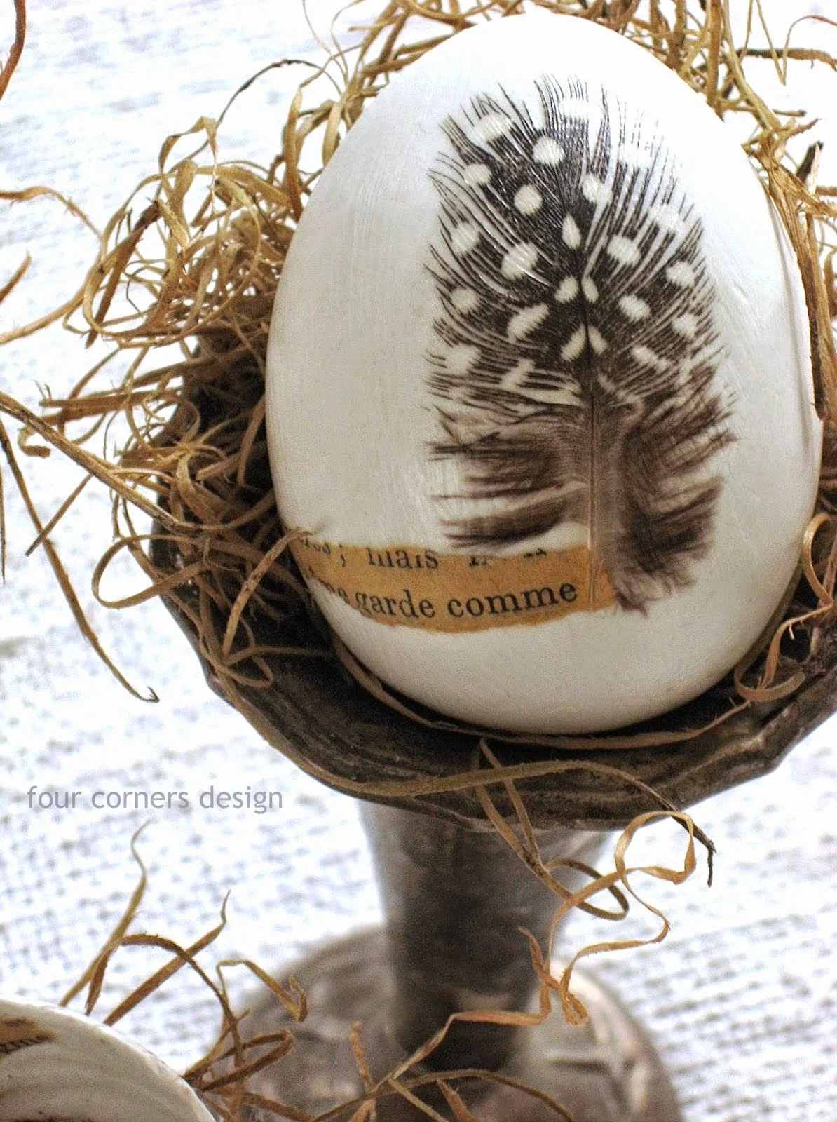Feather embellished Easter eggs by  Four Corners Design featured on I Love That Junk
