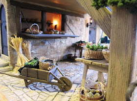 Wheel barrow full of produce in a medieval market hall.