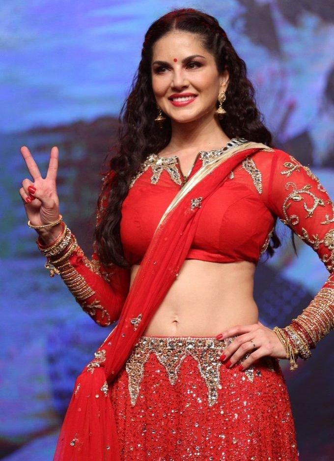 Sunny leone Stills In Red Saree At Telugu Movie Audio Launch