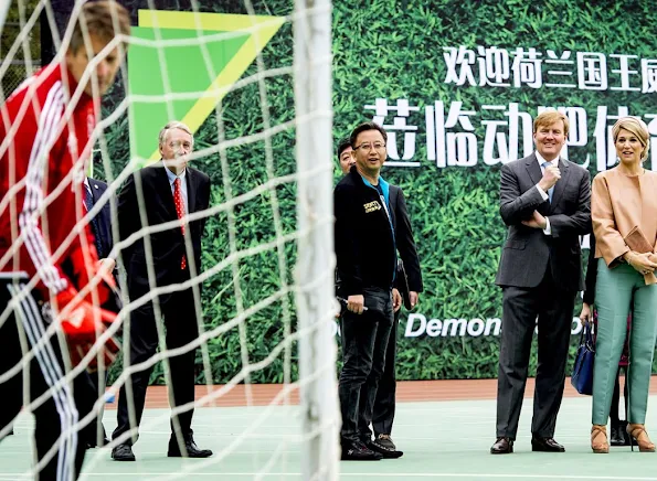 Queen Maxima and King Willem-Alexander of The Netherlands visit the Sino-Dutch Diary Development Center on October 25, 2015 in Beijing, China.