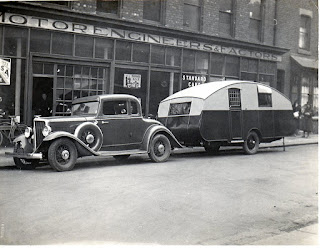 Car and caravan outside Robert Robinsons, Avenue Road Hartlepool