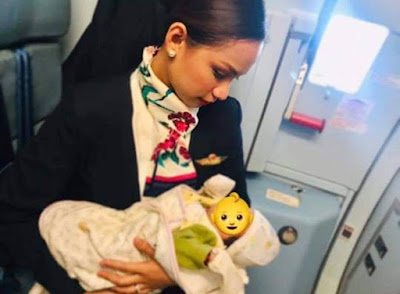 PAL stewardess breastfeeds hungry baby passenger