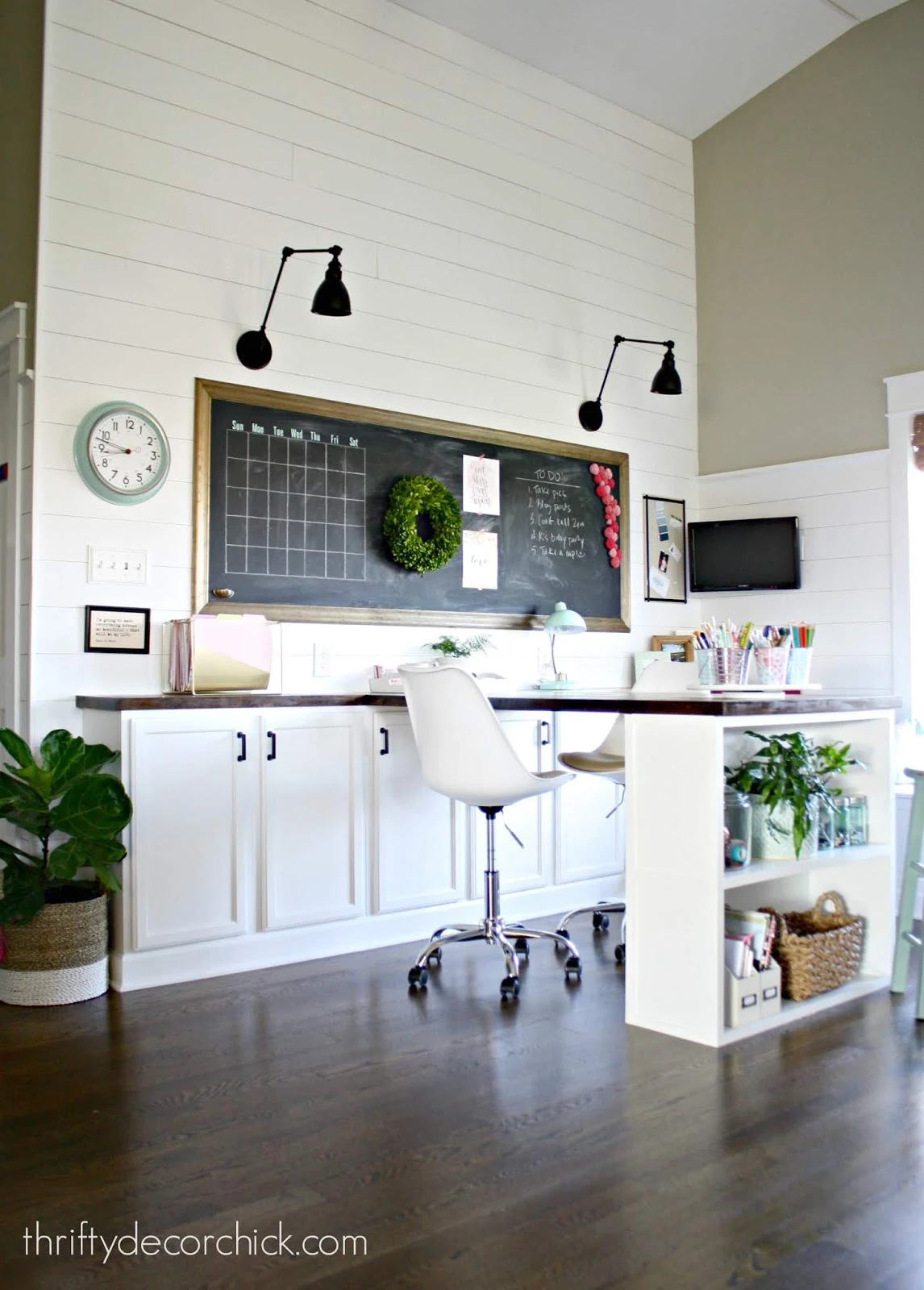 Farmhouse style office with shiplap and large desk with cabinets