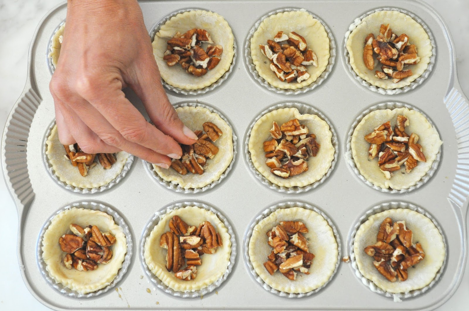 Cooking with Manuela Puff PastryPecan Mini Tarts Topped with Caramelized Pecan Halves