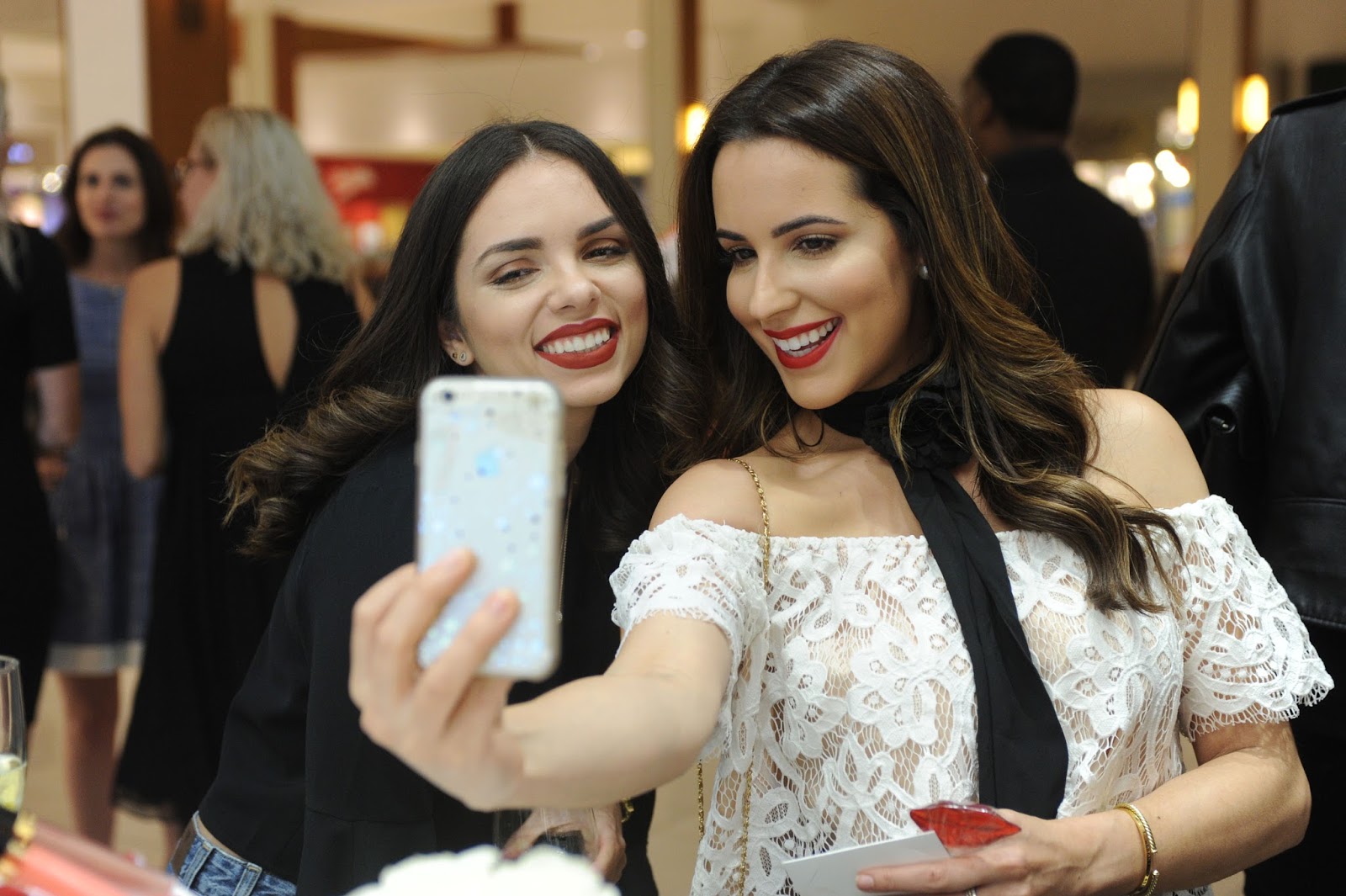  Bloggers Daniela Ramirez and Kelly Saks take selfies at the Chanel Fragrance & Beauty Boutique Opening in Aventura, Florida