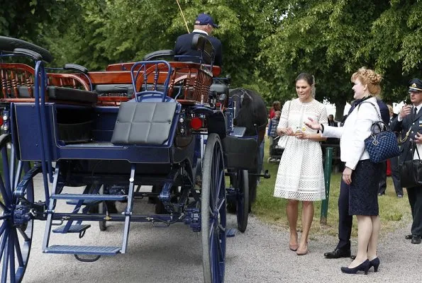 Crown-Princess Victoria wore By Malina Emily Midi Dress, Gianvito Rossi pumps and she carried Ralph Lauren Ricky chain bag, Sweden's National Day 2018