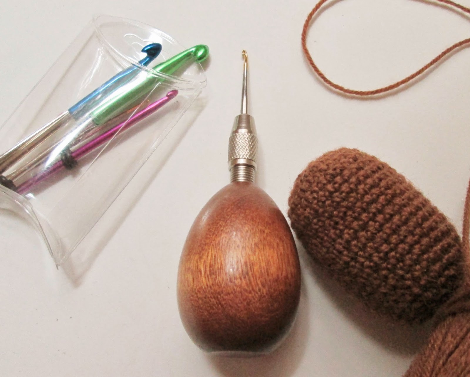 The Lion Brand Ergonomic Hook Set is pictured here with Lion Brand yarn, "Sock-Ease" in dye color "Root Beer."