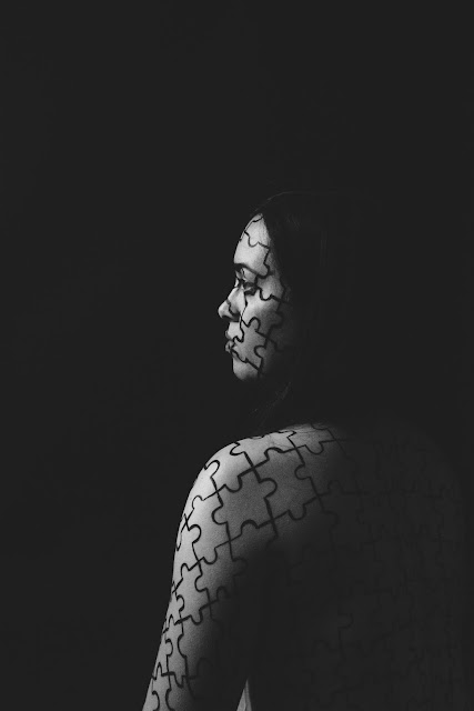 black and white profile portrait, body paint, puzzle