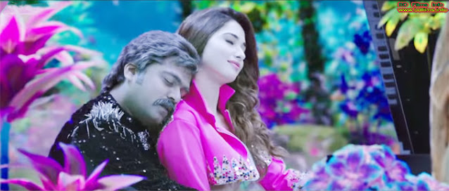 Silambarasan and Tamannaah in AAA (2017) Tamil movie Anbanavan Asaradhavan Adangadhavan is an Indian Tamil language action comedy film written and directed by Adhik Ravichandran and produced by S. Michael Rayappan. The film is starred by Silambarasan, Shriya Saran and Tamannaah in the lead roles. But others have played their roles in the supporting character. Review: At first I want to say that the film is an incomplete film. Action, comedy or others are good but the story seems it is incomplete. Specially, the film has no ending point. Every film has three aspects. 1. the Beginning 2. the Middle and 3. the Ending. Actually climax stays in the middle. Climax is also in the middle in the movie. But ending point is not here at the last scene. In the last some sequence, I have checked several times the duration that why the film is not turning its ending. But I am thinking and the film screen is finished. But the story is not finishing at all. I have wanted know several times the conditions of Selvi ( Shriya Saran) but the screen does not show. Actually, the film is showing self worshiping or private thinking and this is injurious for the success of its box office. I think there are some weaknesses in the movie. First of all, performances of some supporting characters are one of them. Background music or sound is good. The performances of the lead characters are also best. The graphics are awesome or the actions scenes are good. But the story cannot reach towards and so all time it is taking its summary at the middle point and cannot finished its story. Cinematography of the film is good and the editing style is also normal but VFX is awesome. Make up and costumes are also suited for the characters. But the film is slow motioned. Sometimes, I noticed that some scenes are unused and cannot create movement or cannot go forward at all. So, the scenes are excessive for the movie. In a word the film is self worshiping and upholds its private thinking. AAA (2017) Tamil Film