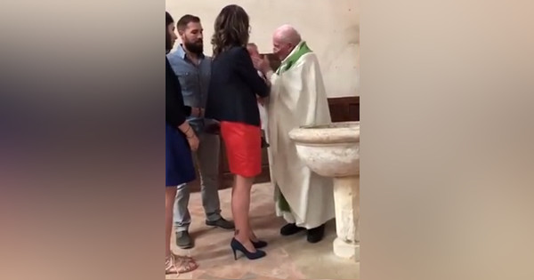 Priest slammed for slapping a crying baby