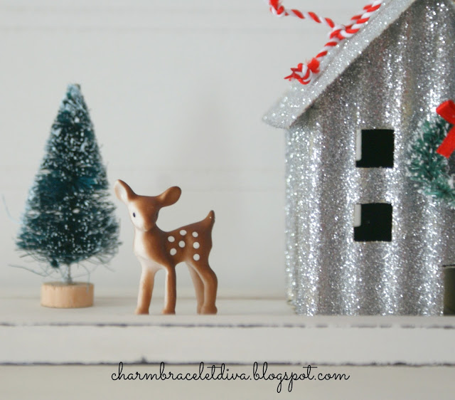 Darling miniature deer beside glittered house and bottle brush tree