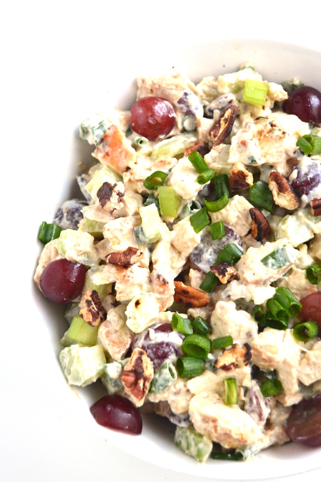 Healthier Chicken Salad is super easy to make and full of flavor with celery, grapes, pecans and green onion! The dressing is protein rich with Greek yogurt and a hummus spread. www.nutritionistreviews.com