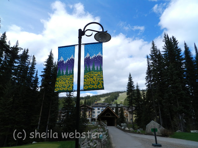 The path from the golf course leads across the covered walking bridge to the village of Sun Peaks.