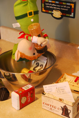 elf on the shelf advent bible study cooking in kitchen