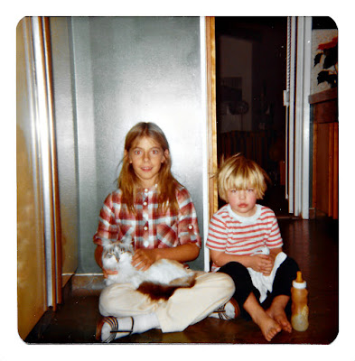 Jessica Butz poses with a cat in her lap in the kitchen at 19 Ramona Avenue in March of 1980.